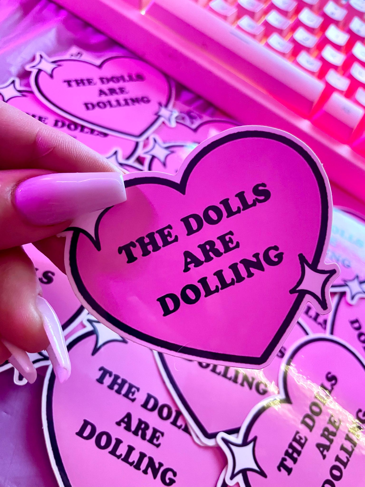 THE DOLLS ARE DOLLING STICKER