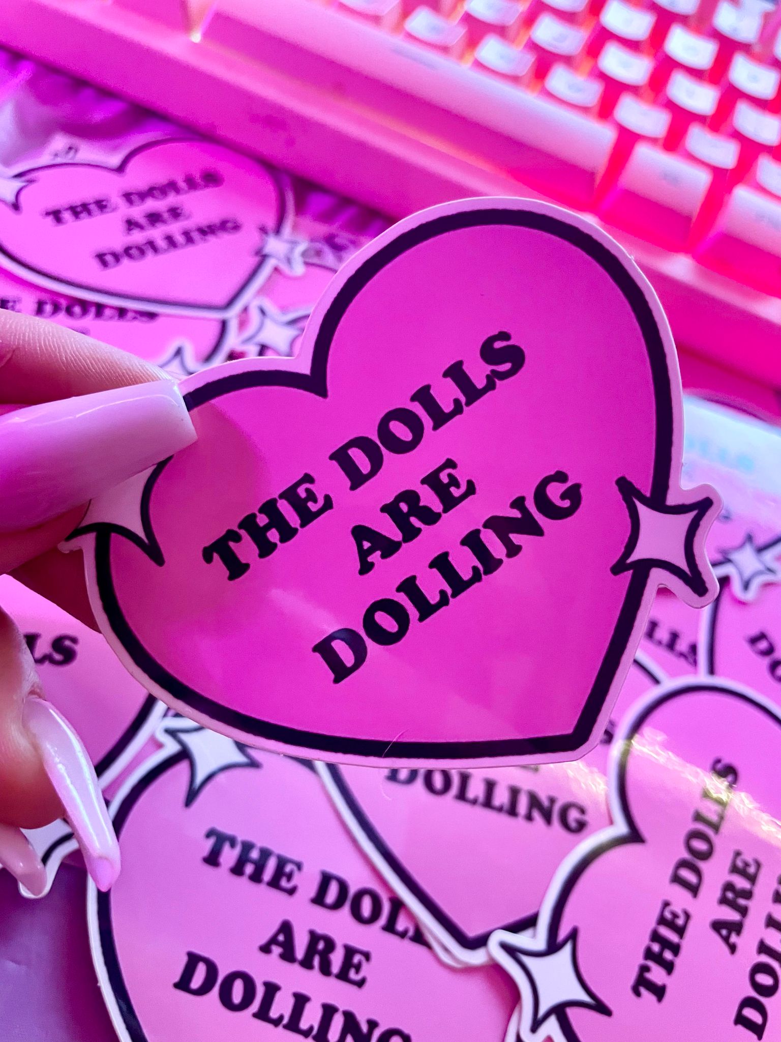 THE DOLLS ARE DOLLING STICKER