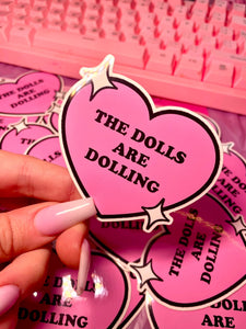 THE DOLLS ARE DOLLING STICKER