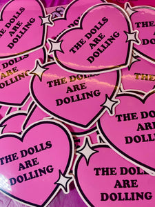 THE DOLLS ARE DOLLING STICKER
