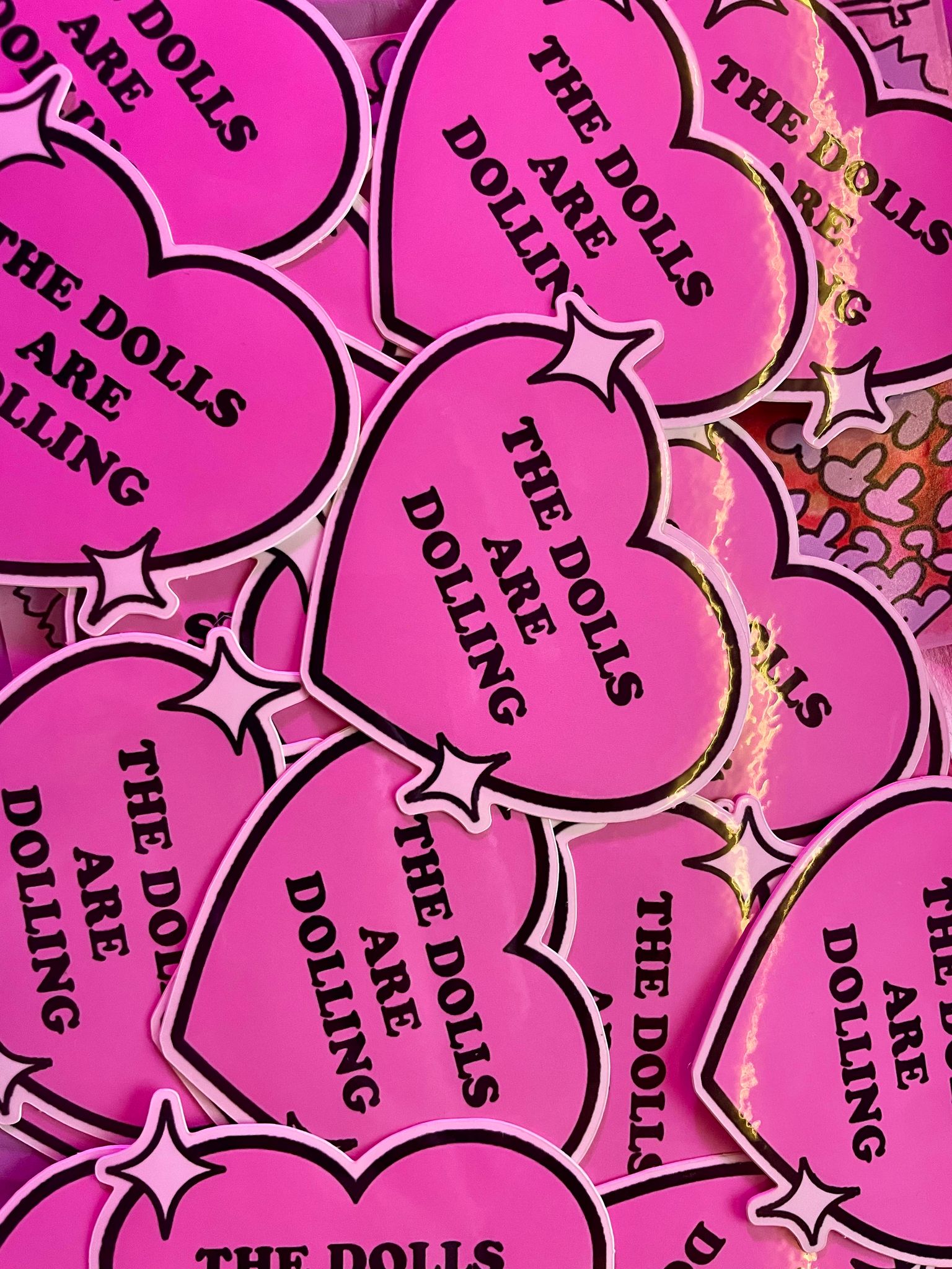 THE DOLLS ARE DOLLING STICKER