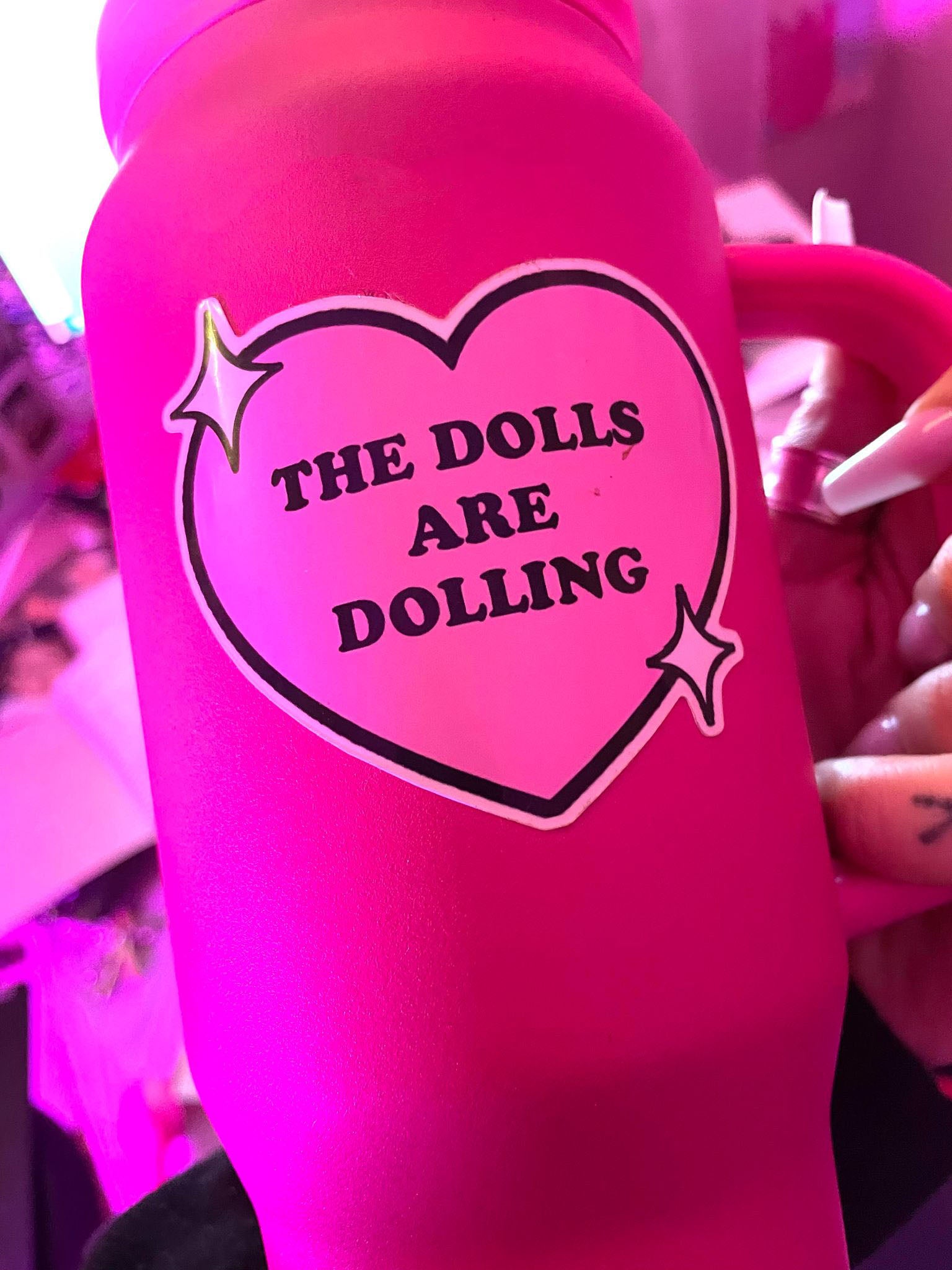 THE DOLLS ARE DOLLING STICKER